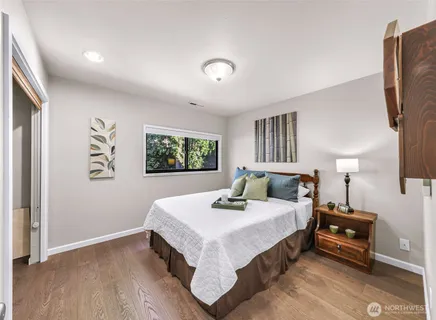 a bedroom with a bed and window