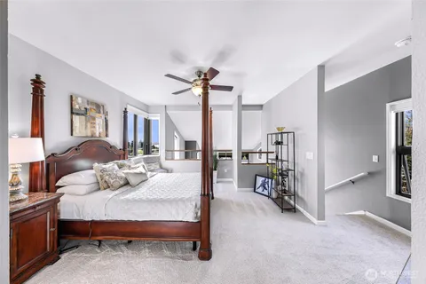 a bedroom with a bed and a mirror