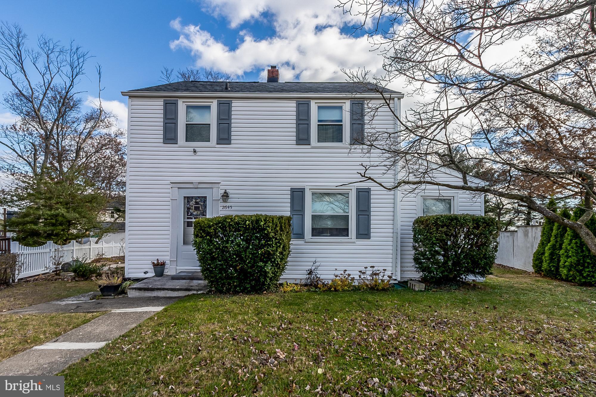 2645 Spring Road Parkville, MD 21234 - Photo 1 of 47 Charming two-story home with lush greenery.