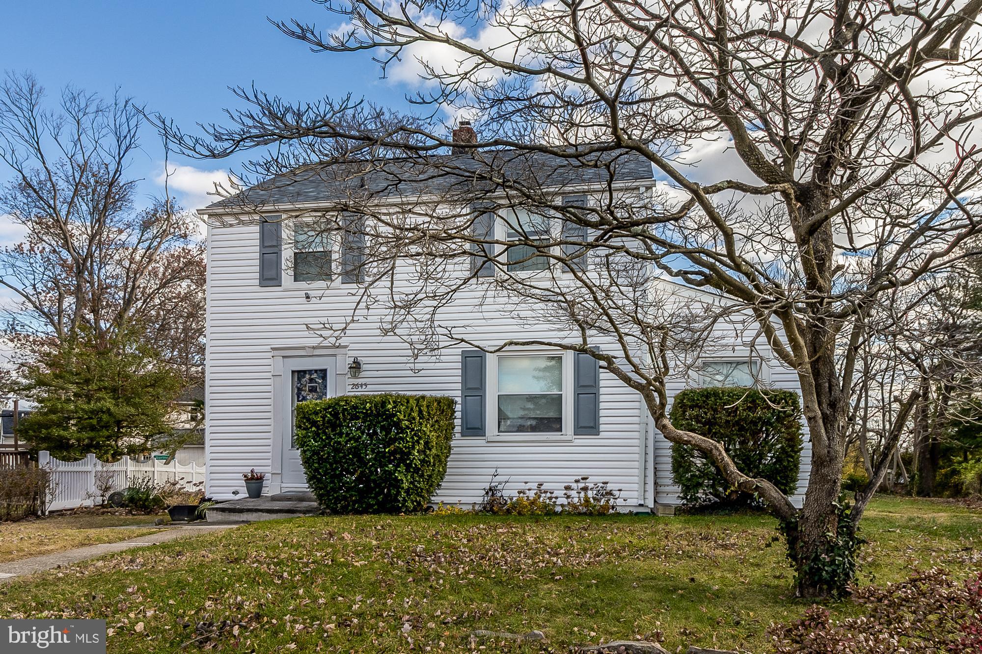 2645 Spring Road Parkville, MD 21234 - Photo 3 of 47 Charming two-story home with lush greenery.