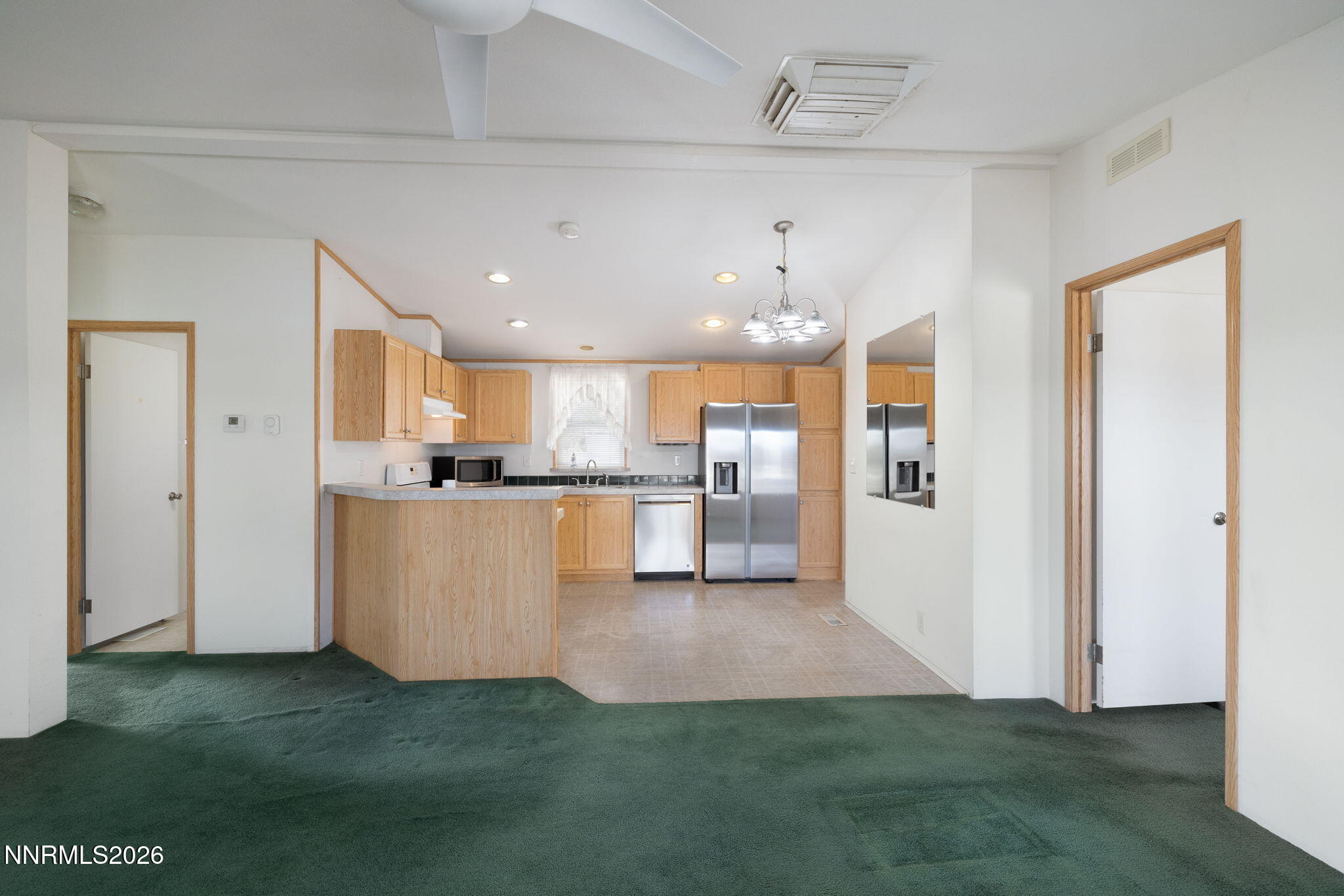 4 Mobil Drive Yerington, NV 89447 - Photo 14 of 26 a view of kitchen and kitchen with microwave