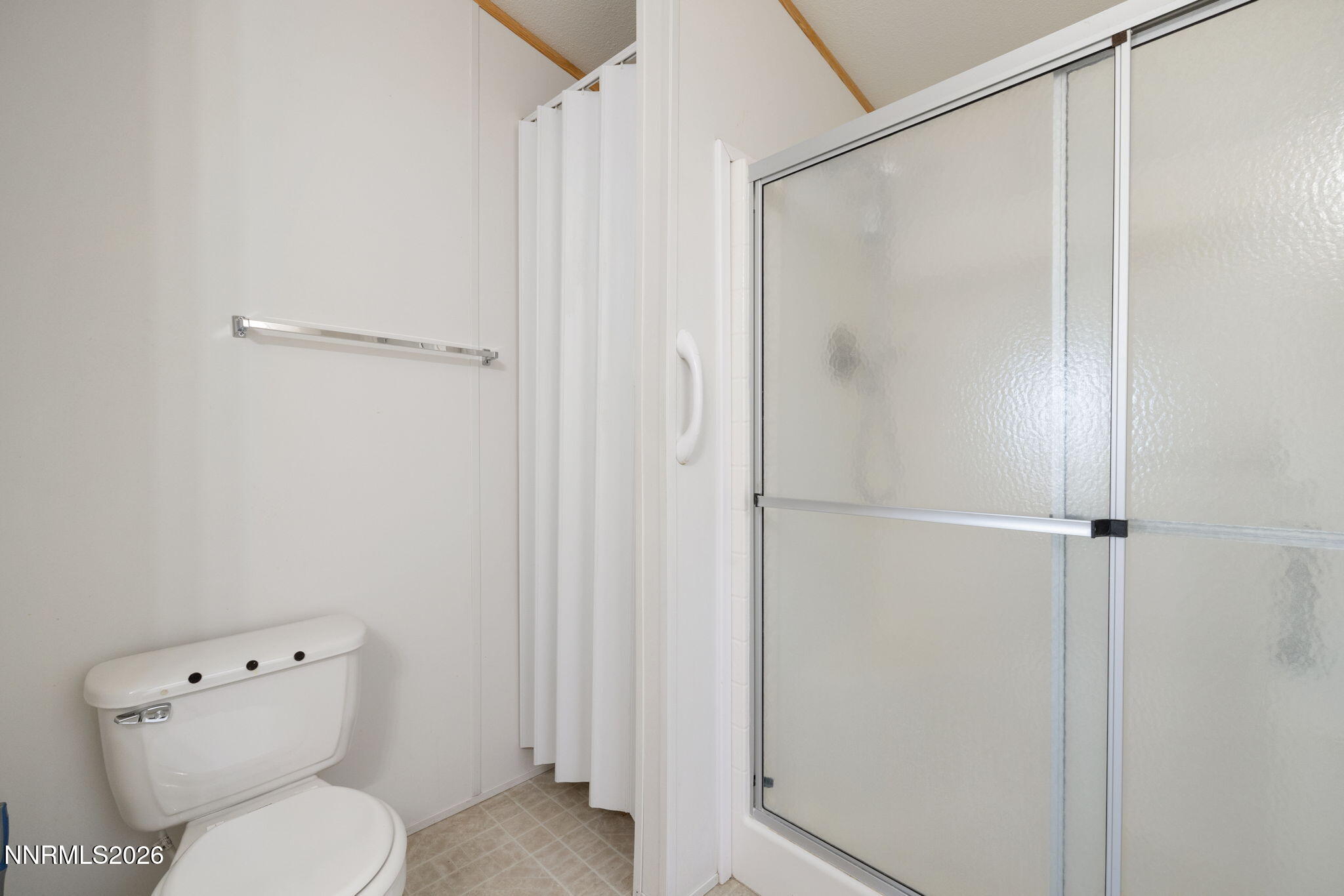 4 Mobil Drive Yerington, NV 89447 - Photo 18 of 26 a bathroom with a toilet and a shower