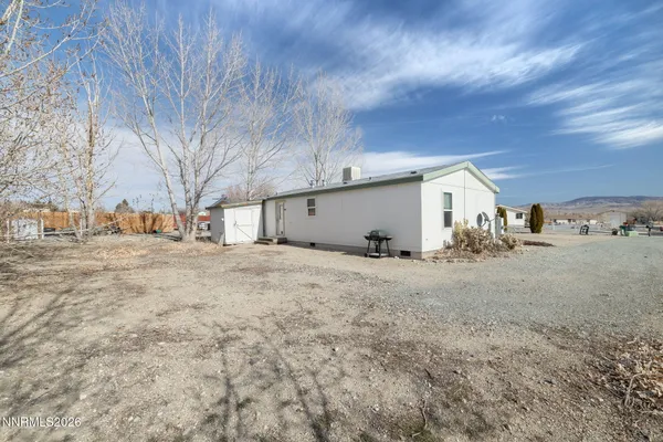a view of a house with a yard and garage