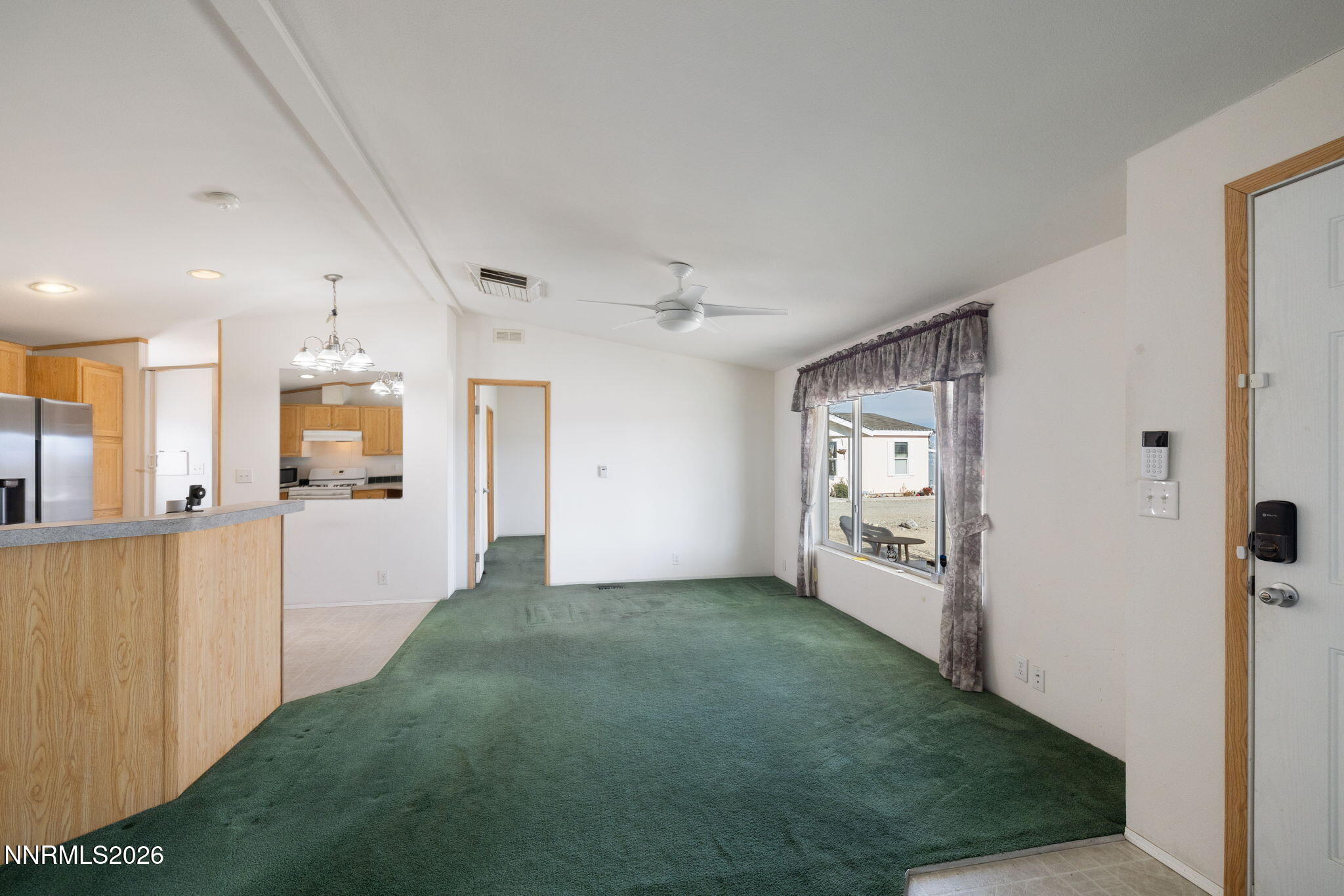 4 Mobil Drive Yerington, NV 89447 - Photo 9 of 26 a view of a big room with closet and windows