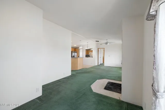 a view of a kitchen with a sink and a window