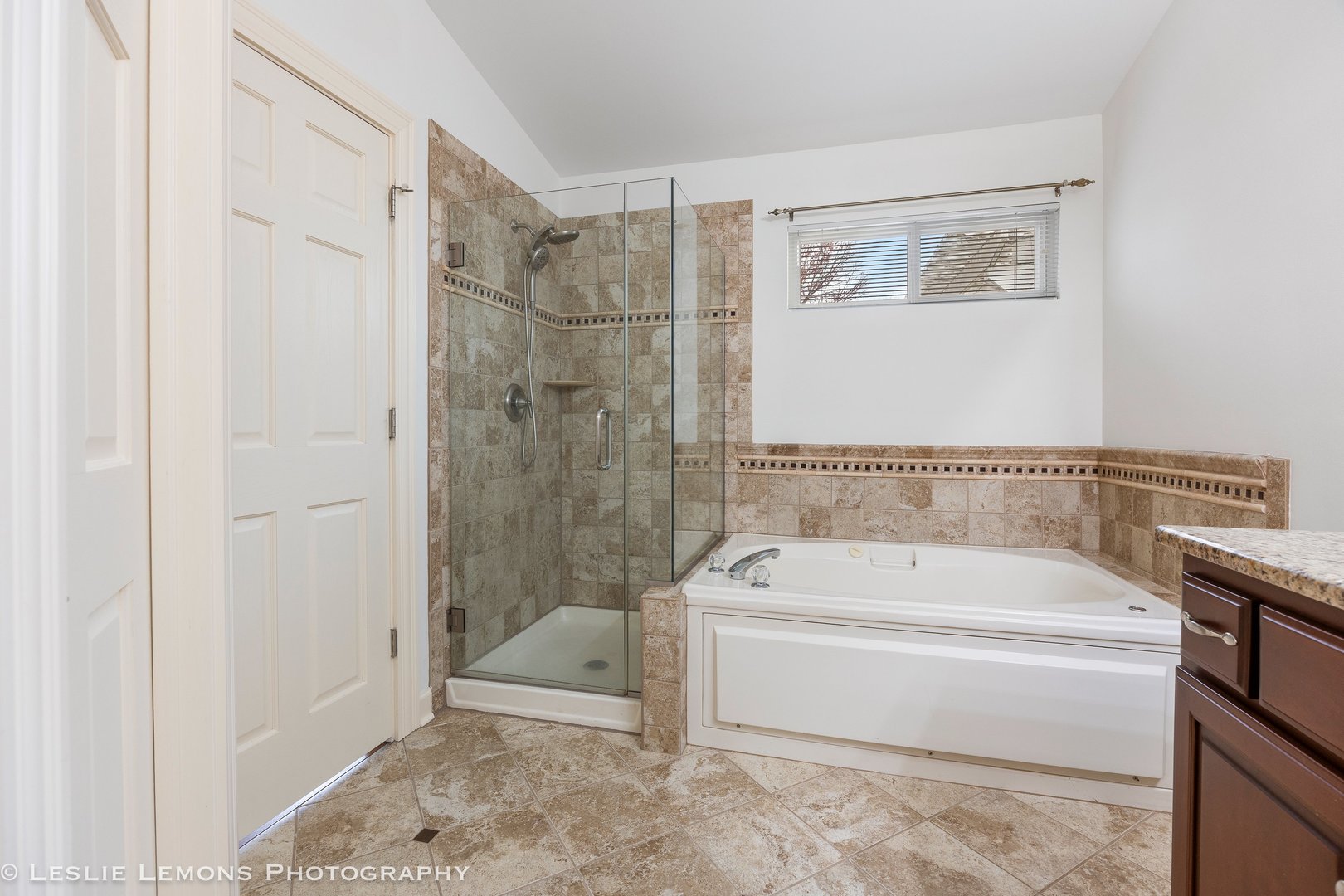 1940 Baldwin Way Bolingbrook, IL 60490 - Photo 14 of 28 a spacious bathroom with a bathtub and a shower