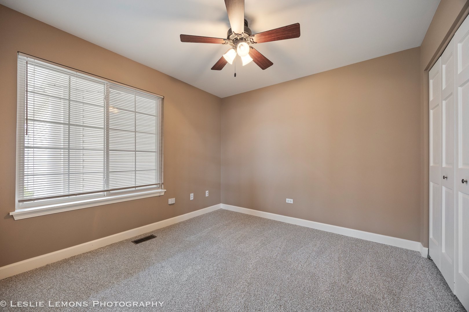 1940 Baldwin Way Bolingbrook, IL 60490 - Photo 15 of 28 an empty room with windows and fan