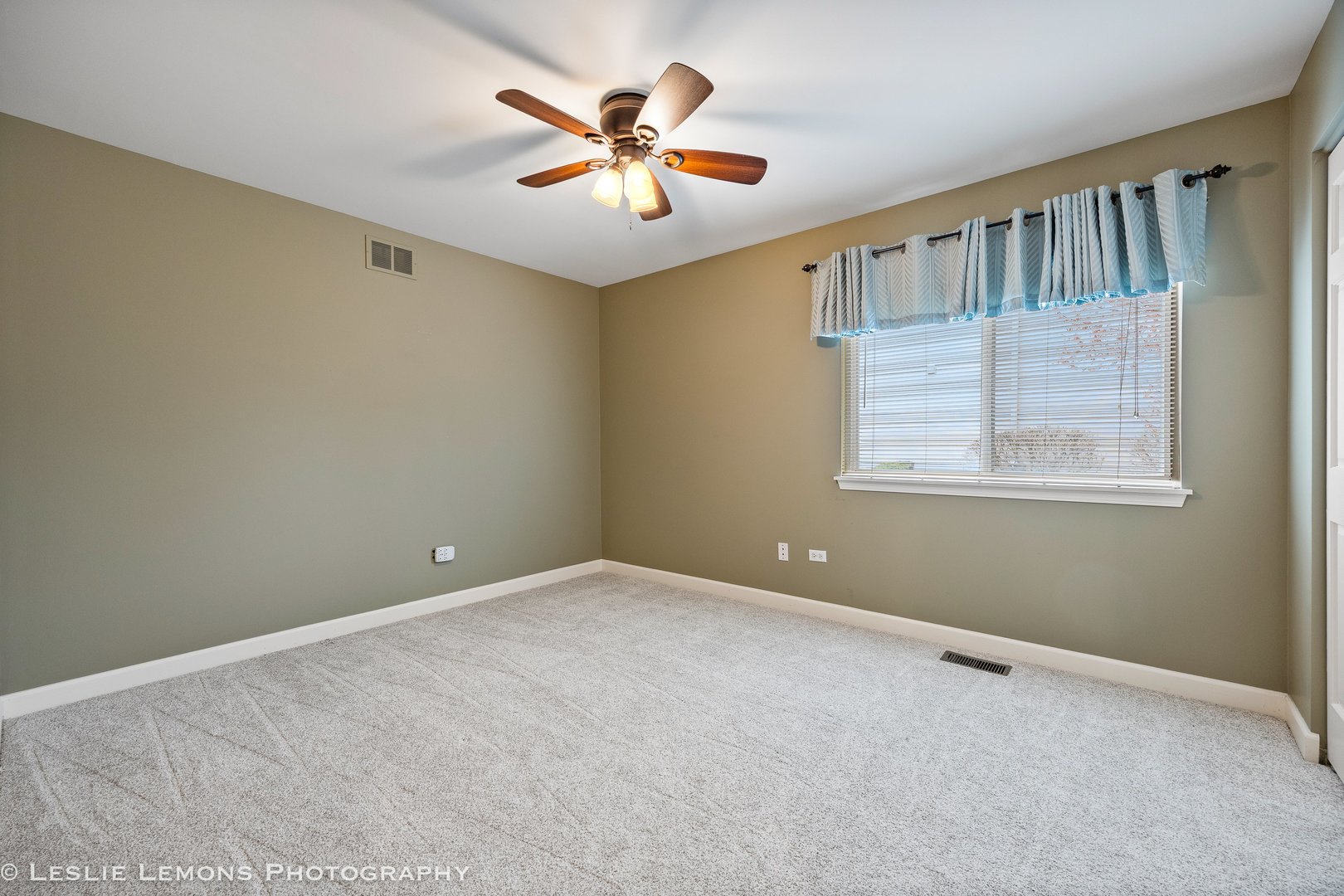 1940 Baldwin Way Bolingbrook, IL 60490 - Photo 17 of 28 an empty room with windows and fan