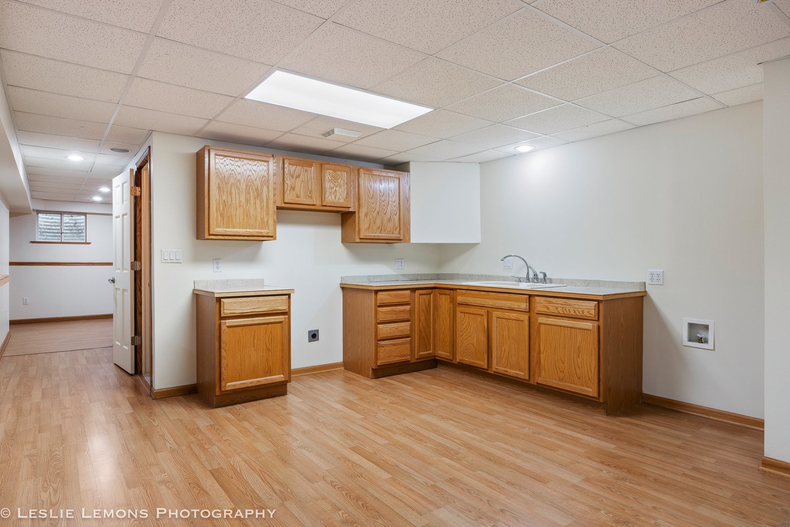 1940 Baldwin Way Bolingbrook, IL 60490 - Photo 20 of 28 a kitchen with granite countertop a sink cabinets and wooden floor