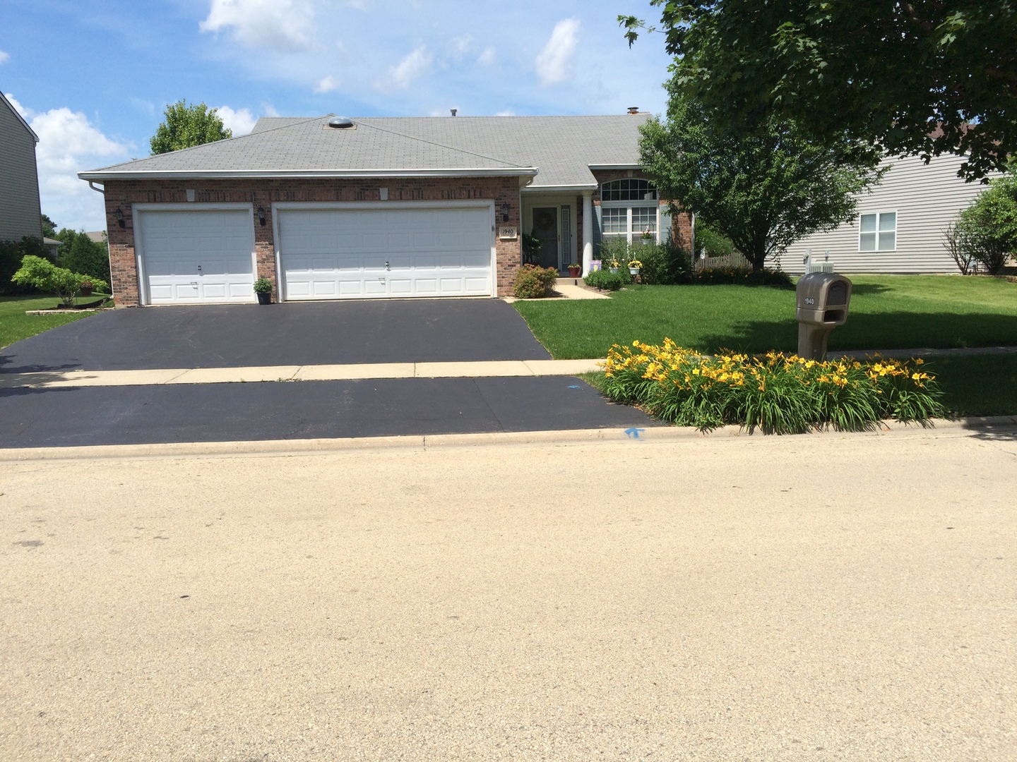 1940 Baldwin Way Bolingbrook, IL 60490 - Photo 28 of 28 a front view of a house with a yard and garage