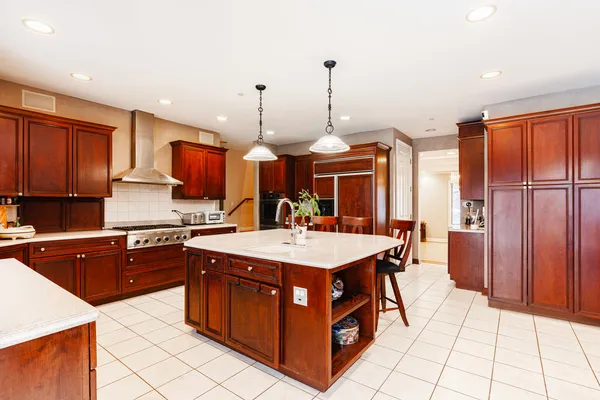 a kitchen with stainless steel appliances a sink stove and refrigerator
