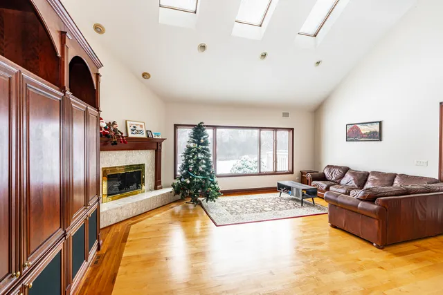 a living room with furniture fireplace and flat screen tv