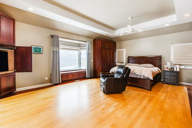 a bed room with furniture and wooden floor