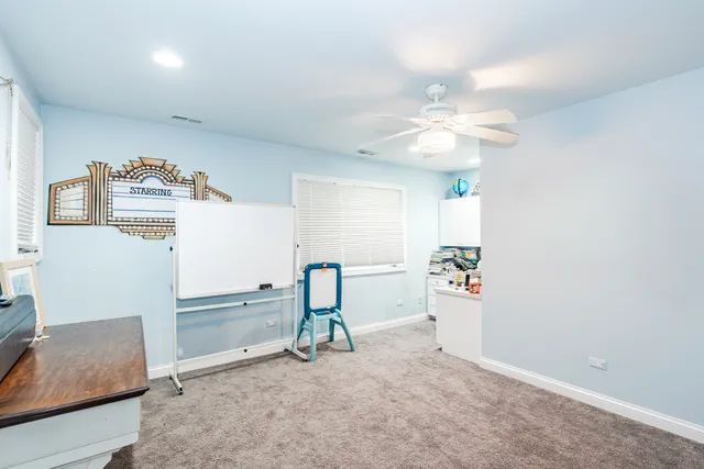 a view of livingroom with furniture and ceiling fan
