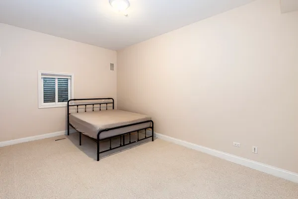 a room with a bed and a window