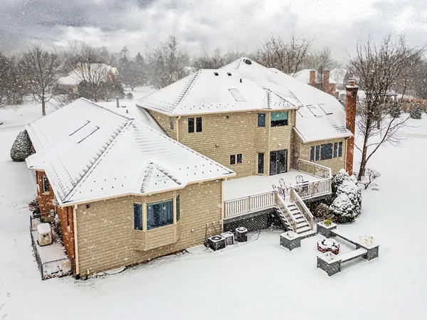 a view of a terrace with a table and chairs
