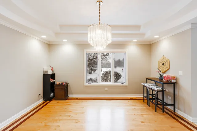 a view of a room with wooden floor and windows