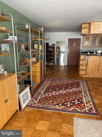 a view of a gallery with wooden floor