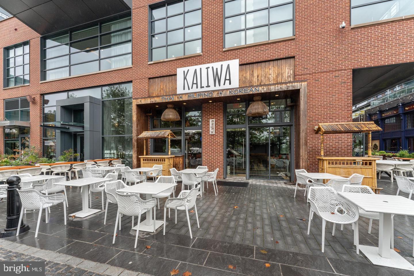 1425 4th Street Southwest, Unit A210 Washington, DC 20024 - Photo 29 of 43 a view of a cafe with a table and chairs in front of it