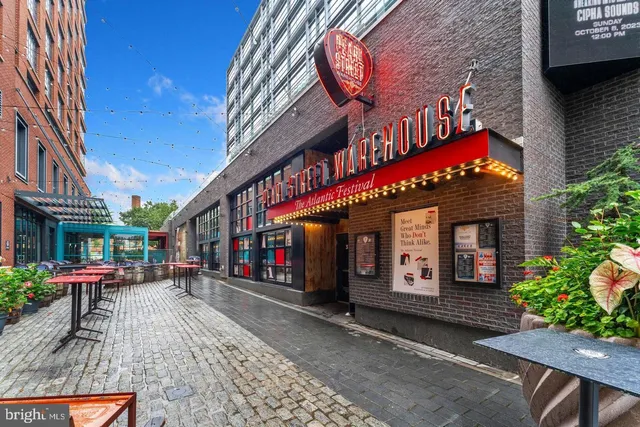 a view of a cafe with sitting area