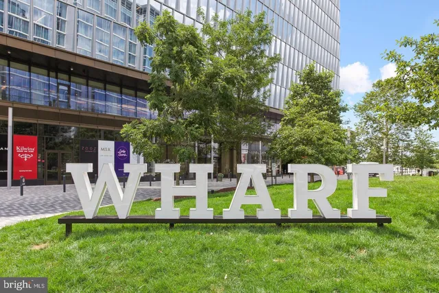 a view of a chair and table in backyard of the house