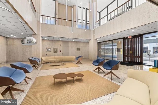 a outdoor space with lots of chairs and mirrors