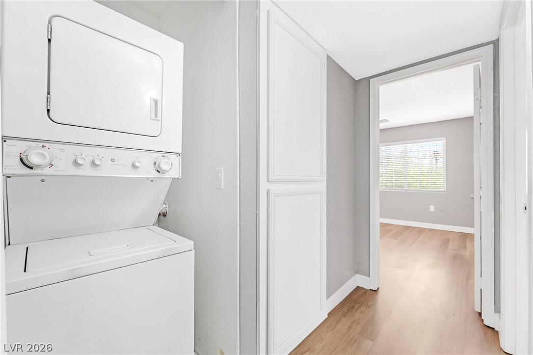 3318 North Decatur Boulevard, Unit 2152 Las Vegas, NV 89130 - Photo 30 of 58 Integrated laundry facilities optimize space, featuring modern appliances and easy access for daily convenience.
