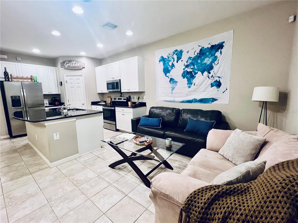 7007 Towne Lake Road Riverview, FL 33578 - Photo 5 of 16 a living room with furniture a couch and a coffee table