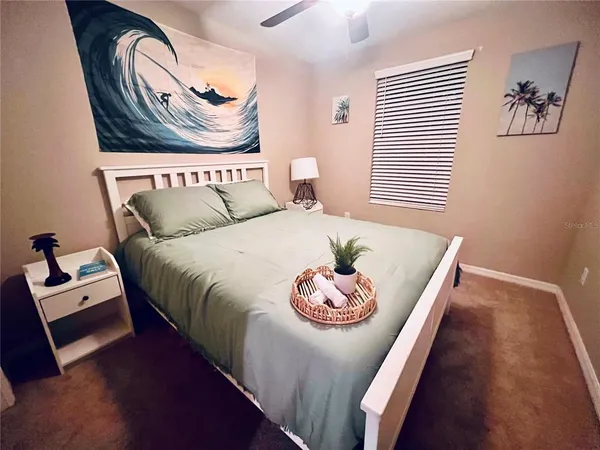a bedroom with a bed and a table in it