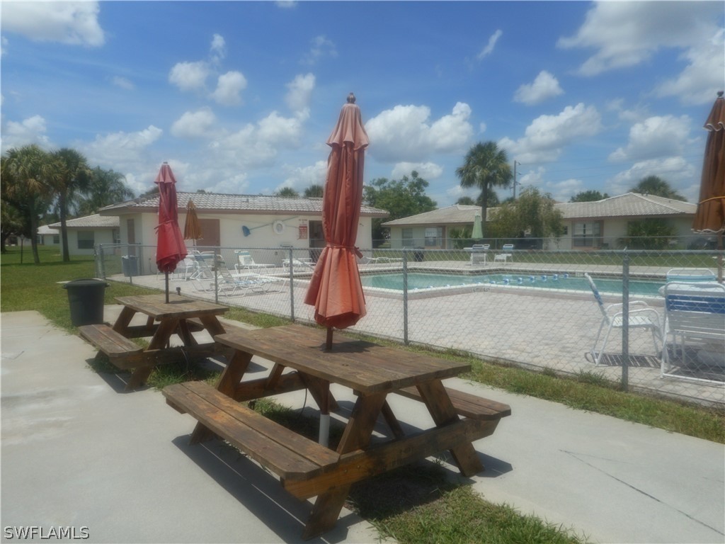 1614 Ridgecrest Street Lehigh Acres, FL 33936 - Photo 8 of 31 a view of a backyard with sitting area
