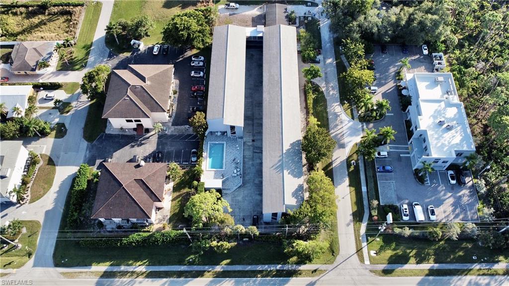 826 Wiggins Pass Road, Unit 310 Naples, FL 34110 - Photo 17 of 18 Aerial view of residential area