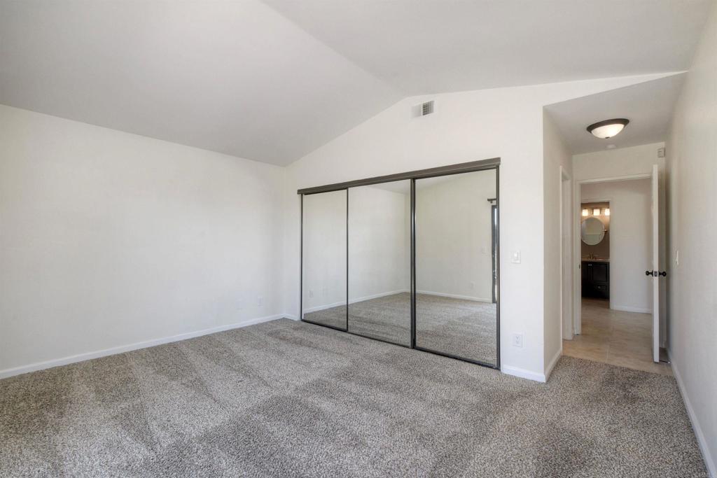 1394 Longfellow Road Vista, CA 92081 - Photo 27 of 50 an empty room with sliding glass door