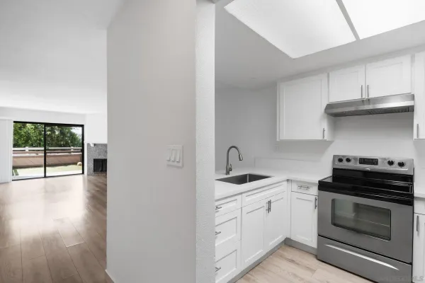 a kitchen with a stove and a sink