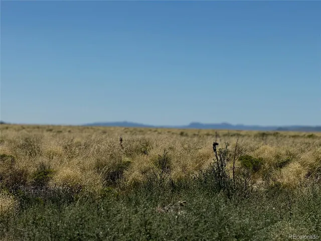 a view of mountains and valleys
