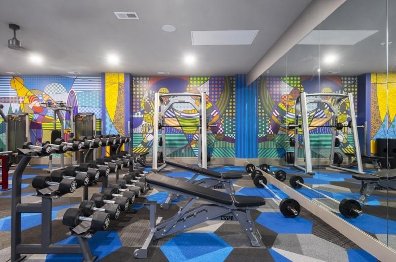 429 Forbes Avenue, Unit 1907 Pittsburgh, PA 15219 - Photo 16 of 16 a room with lots of wooden floor furniture and a large window