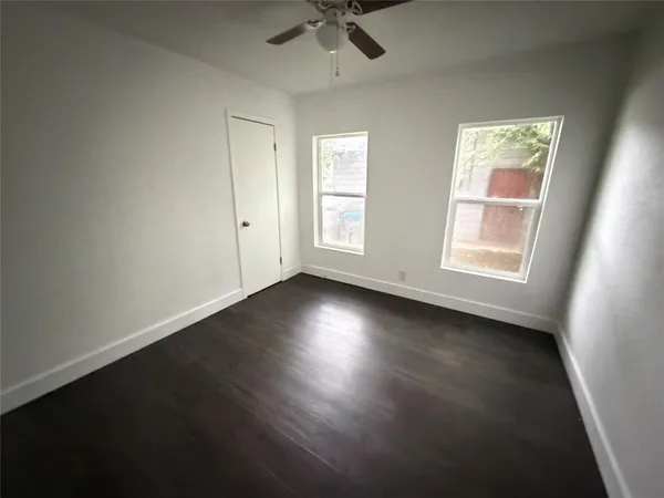 a view of room window and wooden floor