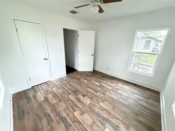 a view of empty room with windows