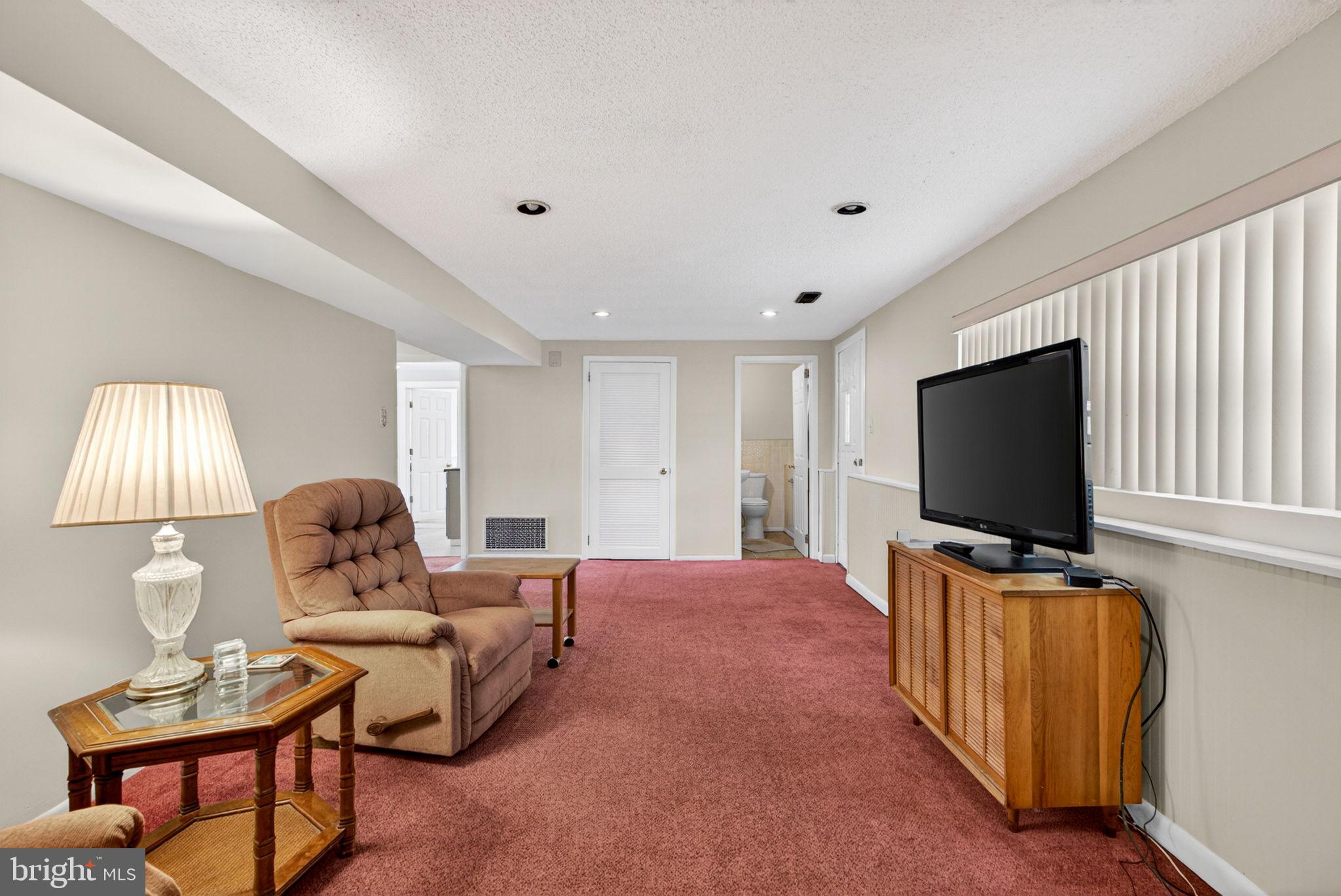 46 Trinity Avenue Marlton, NJ 08053 - Photo 23 of 37 a living room with furniture and a flat screen tv