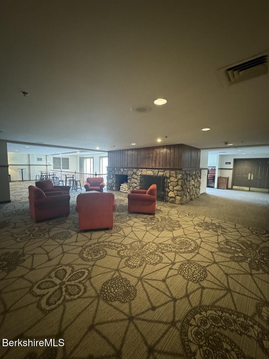37 Corey Road, Unit 521 Hancock, MA 01237 - Photo 11 of 14 a lobby with furniture and a rug