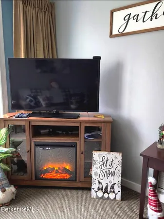 a stove top oven sitting inside of a kitchen