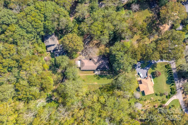 a backyard of a house with a yard and fountain