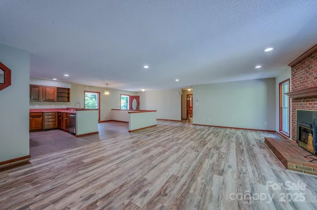 a room with wooden floor and staircase