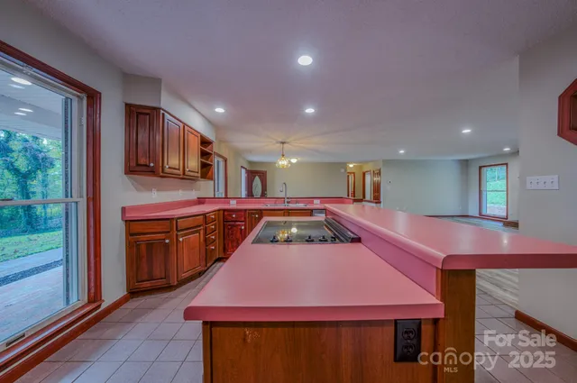 a kitchen with a stove a sink and a refrigerator