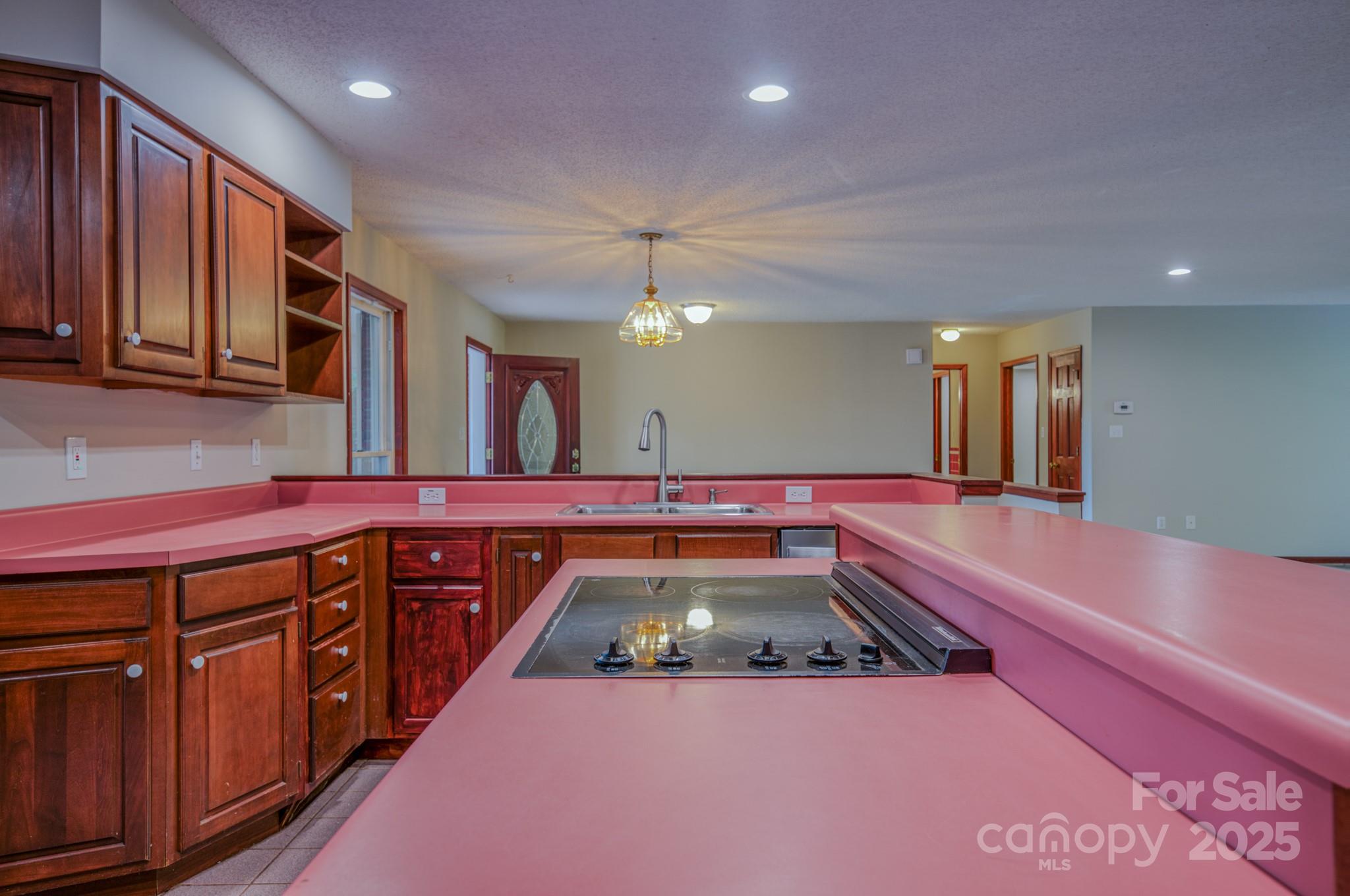 35 Byrd Road Candler, NC 28715 - Photo 21 of 46 a kitchen with a sink and wooden cabinets