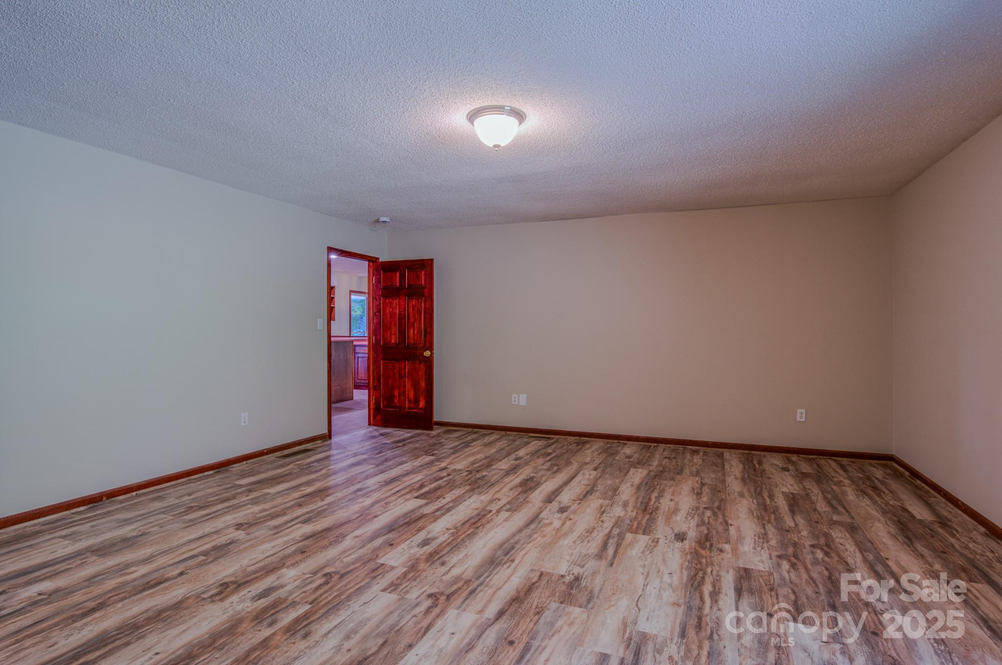 35 Byrd Road Candler, NC 28715 - Photo 27 of 46 a view of an empty room and wooden floor