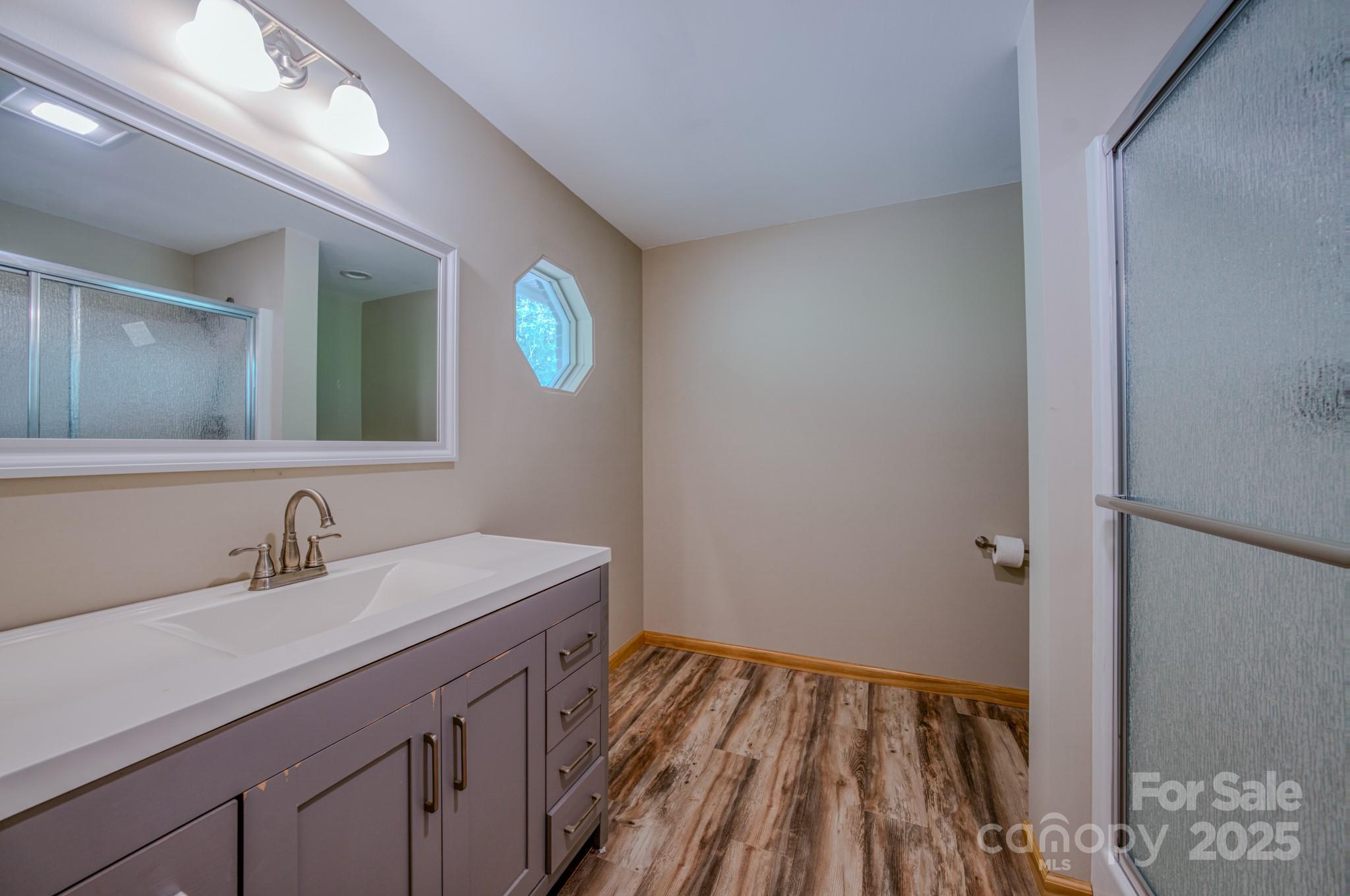 35 Byrd Road Candler, NC 28715 - Photo 28 of 46 a bathroom with a sink and a mirror