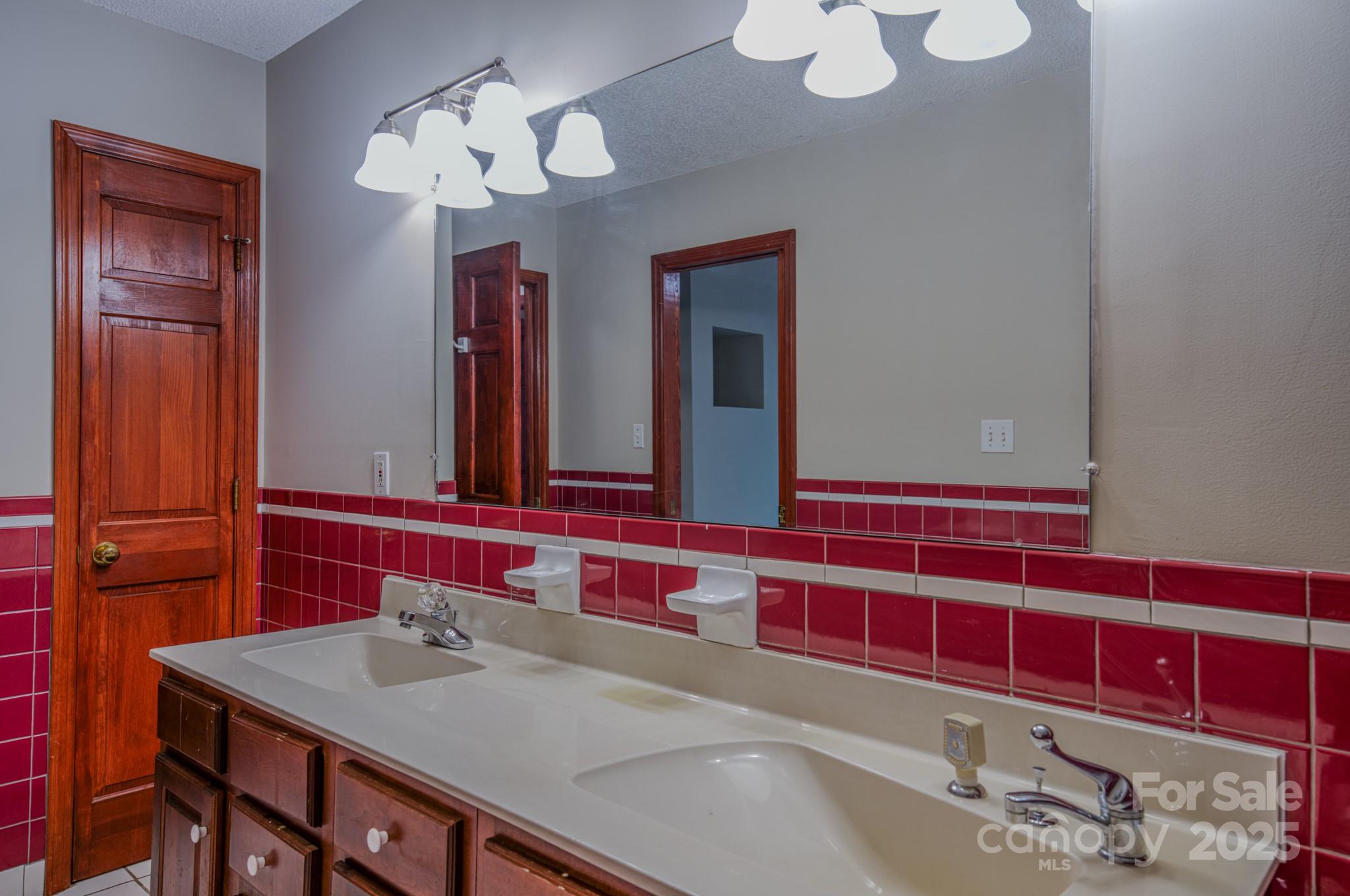 35 Byrd Road Candler, NC 28715 - Photo 35 of 46 a bathroom with a sink and a mirror