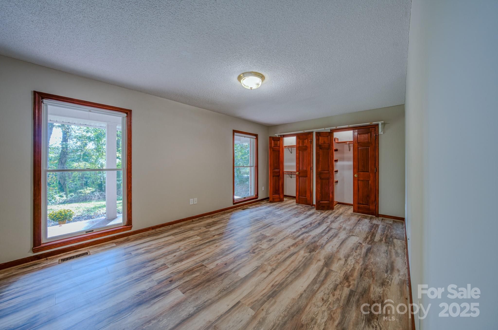 35 Byrd Road Candler, NC 28715 - Photo 36 of 46 a view of an empty room with wooden floor and a window