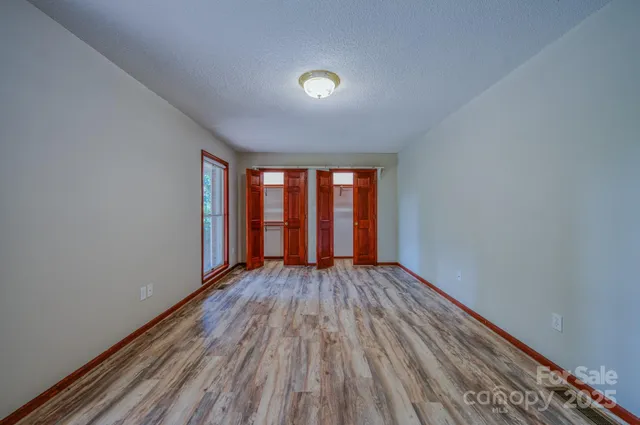 wooden floor and windows in an empty room