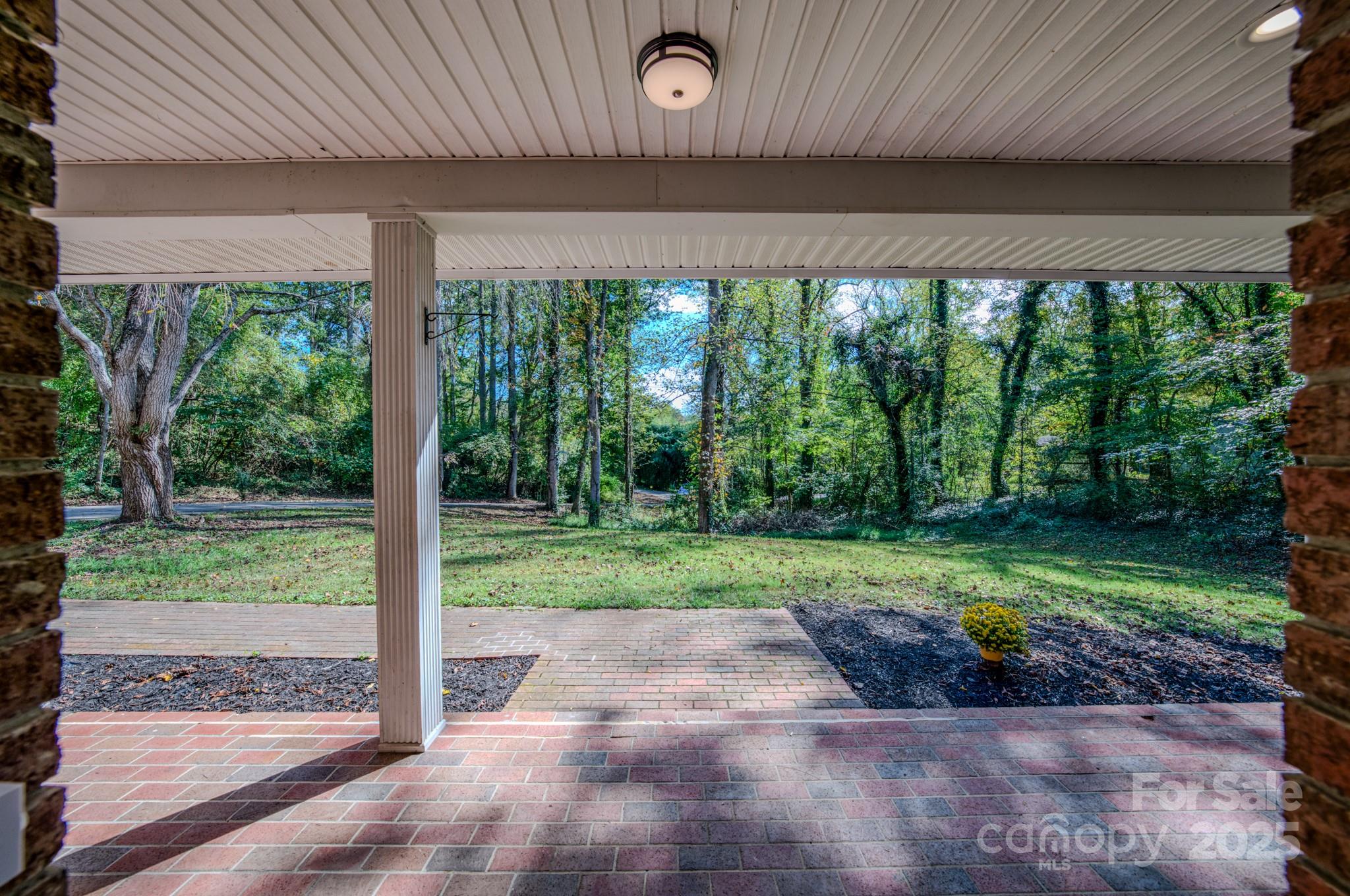 35 Byrd Road Candler, NC 28715 - Photo 39 of 46 a view of a porch with a yard table and chairs